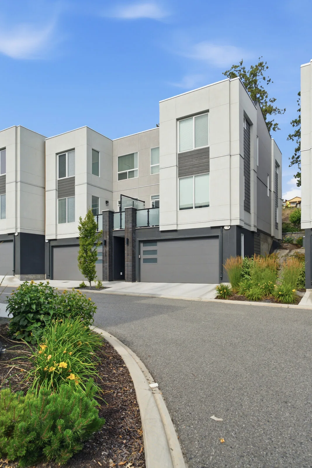 Modern townhome exteriors with low maintenance finishes at Academy Ridge